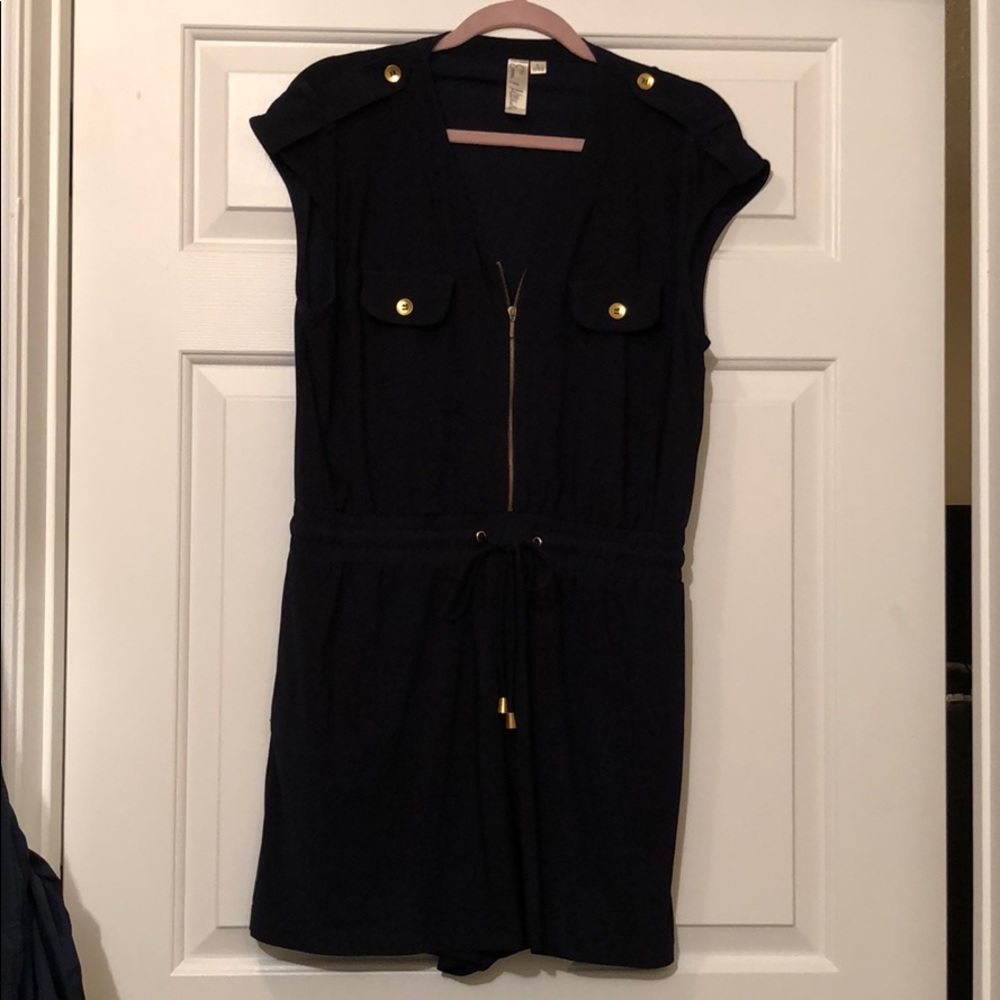Navy romper with banded waist and gold accents